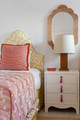 A vibrant island interior by Henrietta Holroyd featuring Puzzle Wallpaper in Lemon, paired with Loom Weave and Peace & Love in Hot Pink. A bold, playful mix of pattern and colour creates a joyful, contemporary atmosphere. Photograph by Ronnie Archer.